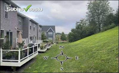 View of a residential home with a hill located in the East direction, illustrating neighborhood effects